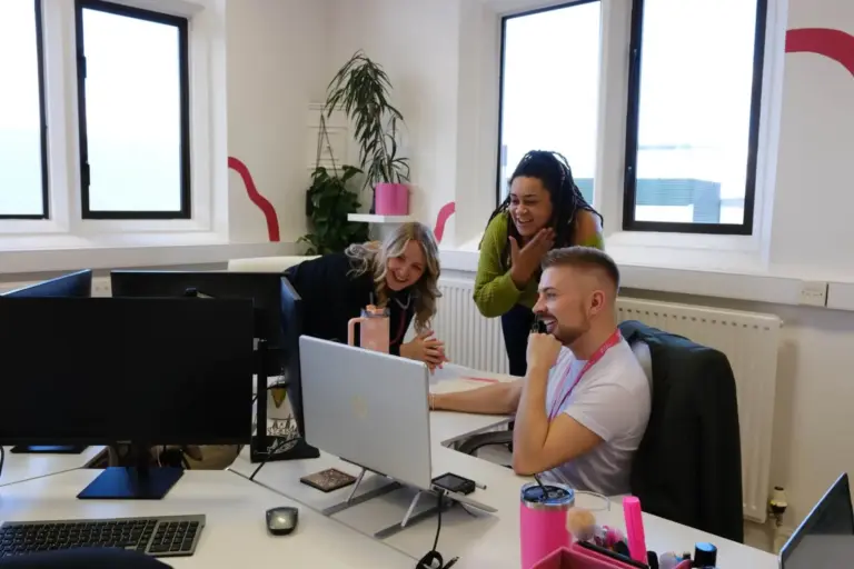 Staff looking at a computer screen